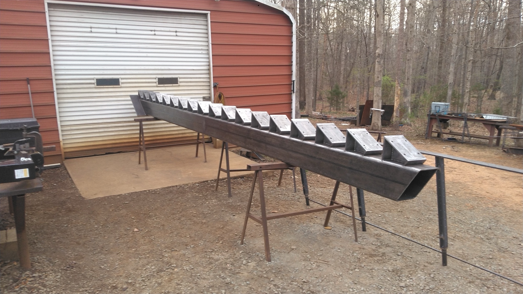 Custom structural steel beam with mounting brackets